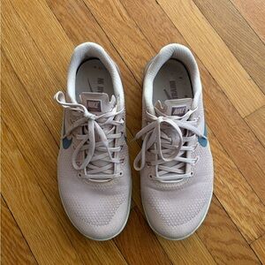 Nike Women's Pale Pink Athletic Sneakers with Blue Swoosh